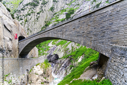 Famous Devil's Bridge at Schöllenen Gorge, Canton Uri, on a sunny summer day. Photo taken July 3rd, 2022, Andermatt, Switzerland.