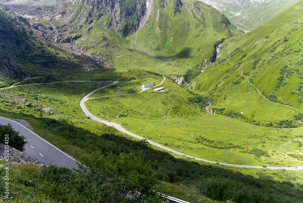 Serpentine mountain pass road of Nufenen Pass in the Swiss Alps on a sunny summer day. Photo taken July 3rd, 2022, Nufenen Pass, Switzerland.