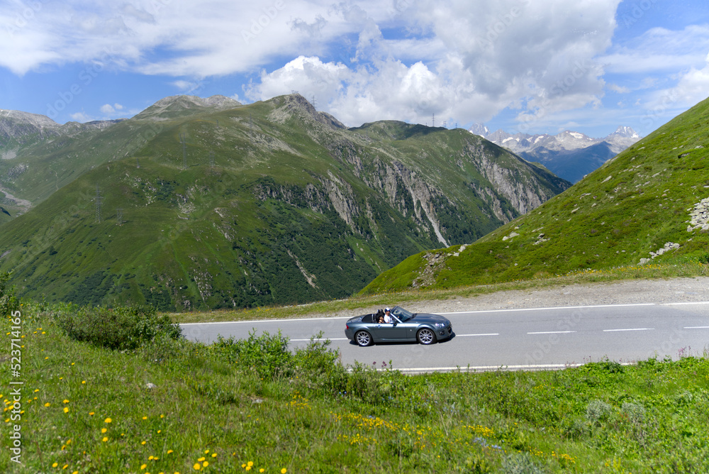 Serpentine mountain pass road of Nufenen Pass in the Swiss Alps on a sunny summer day. Photo taken July 3rd, 2022, Nufenen Pass, Switzerland.