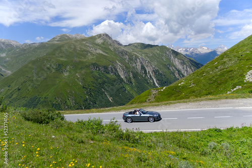 Serpentine mountain pass road of Nufenen Pass in the Swiss Alps on a sunny summer day. Photo taken July 3rd, 2022, Nufenen Pass, Switzerland. © Michael Derrer Fuchs