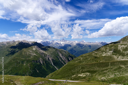 Serpentine mountain pass road of Nufenen Pass in the Swiss Alps on a sunny summer day. Photo taken July 3rd, 2022, Nufenen Pass, Switzerland.