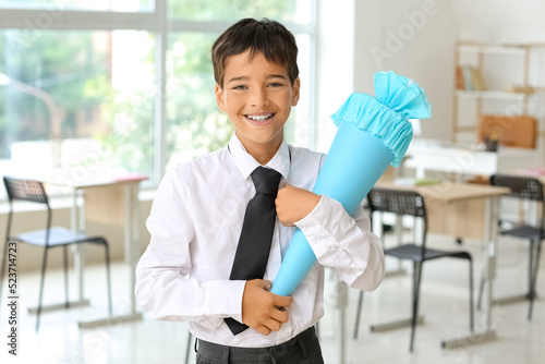 Little boy with blue school...