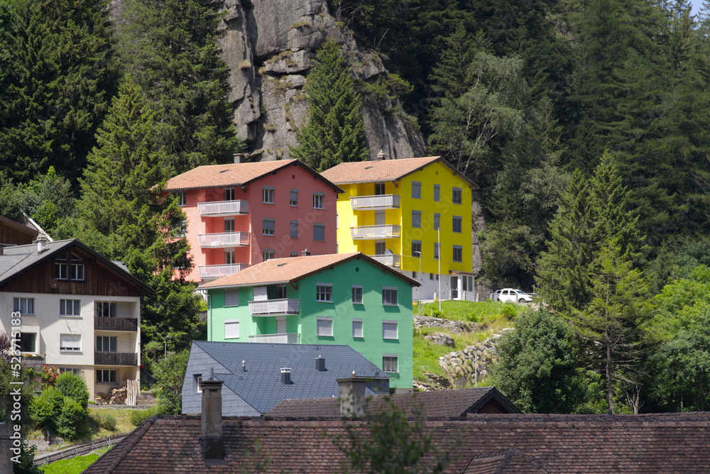 Mountain village Göschenen with beautiful colored houses on as sunny summer day. Photo taken July 3rd, 2022, Göschenen, Switzerland.