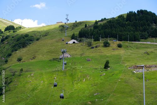 Scenic view of mountains at ski resort Andermatt, Canton Uri, with cable car Nätschen on a sunny summer day. Photo taken July 3rd, 2022, Andermatt, Switzerland.