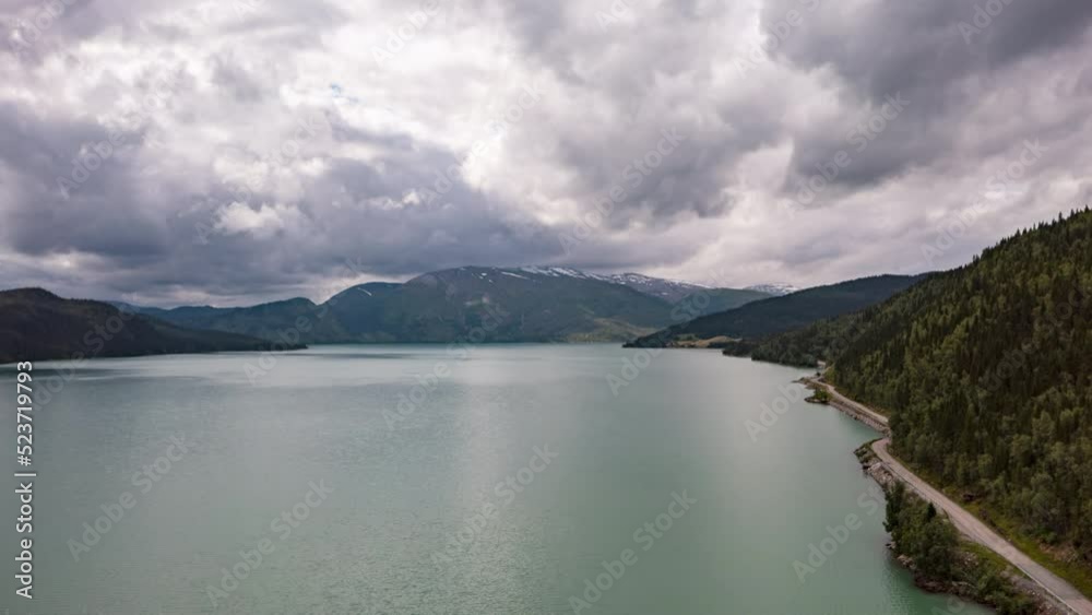 Hyperlapse shot of clouds moving over the Langvatnet glacial lake in North Norway Hyperlapse shot of clouds moving over the Langvatnet glacial lake in North Norway