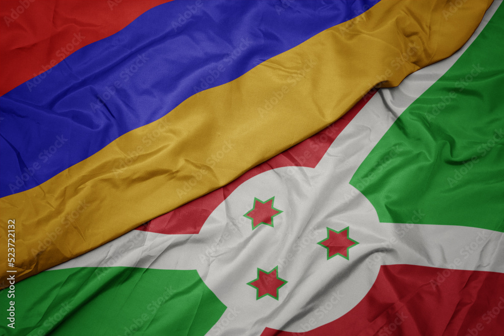 waving colorful flag of burundi and national flag of armenia.