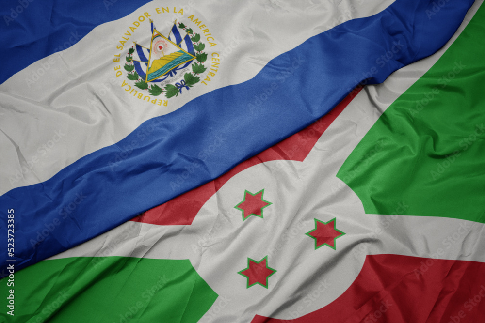 waving colorful flag of burundi and national flag of el salvador. waving colorful flag of burundi and national flag of el salvador.