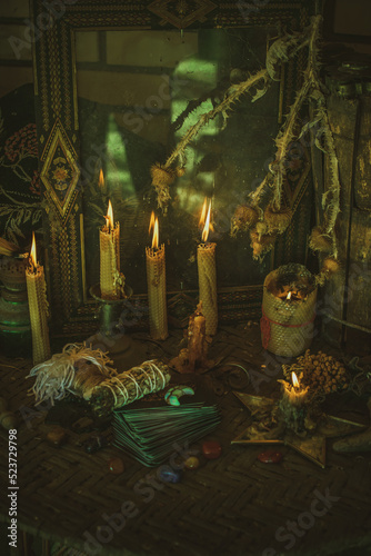 Candle burns on the altar, magic among candles, clean negative energy, wicca concept