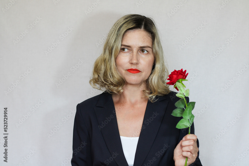 Beautiful middle-aged blond woman on a white background Beautiful middle-aged blond woman on a white background
