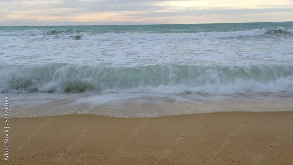Beautiful sea waves and white sand beach in the tropical island. Beautiful view of the sunsets over sea. Ocean beach sunrise and dramatic colorful sky clouds Beautiful sea waves and white sand beach in the tropical island. Beautiful view of the sunsets over sea. Ocean beach sunrise and dramatic colorful sky clouds