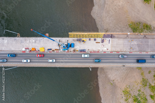 Modernization and repair of highway bridge aerial top view photo