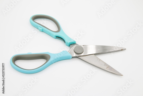 Scissors on the white background