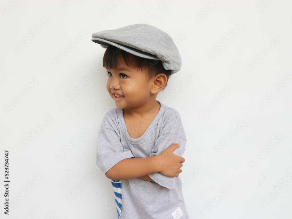 Toddler boy posing smiling, on a white background Toddler boy posing smiling, on a white background