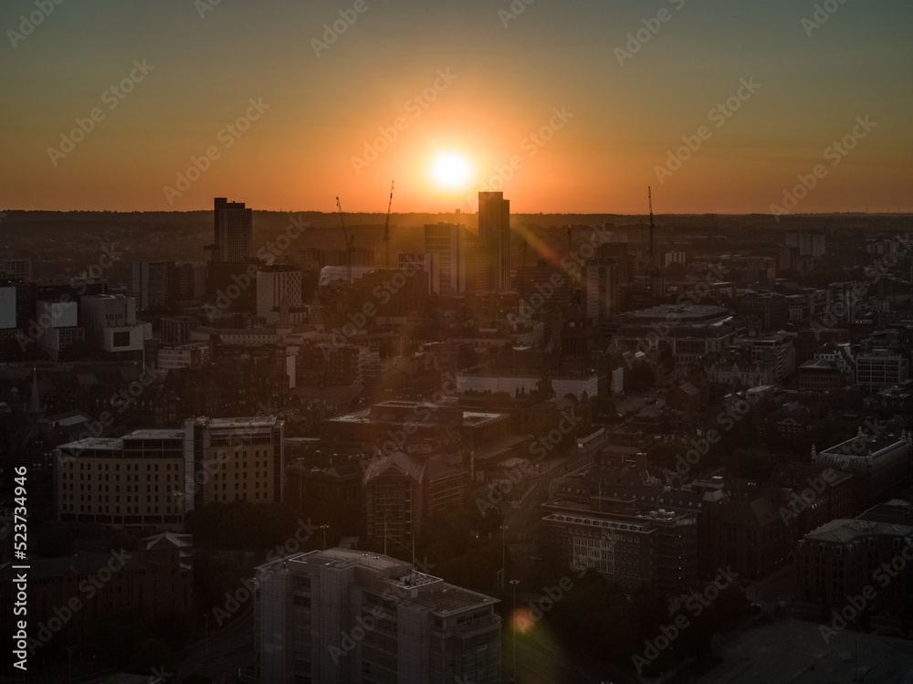 Leeds skyline during a summer sunrise showing Altus House and surrounding buildings and cranes