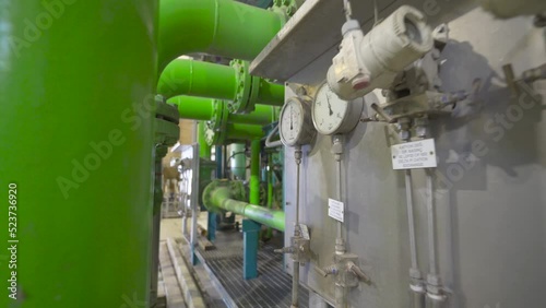 Engineer Checking Position and Pressure Readings of Valves in Pipeline.
Engineer doing inspection check.
