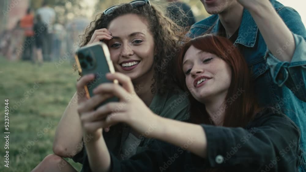 Group of caucasian friends making funny faces for a common selfie on music festival. Shot with RED helium camera in 8K. Group of caucasian friends making funny faces for a common selfie on music festival. Shot with RED helium camera in 8K.