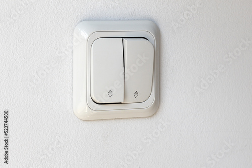 White electricity switch button for indoor use, side view