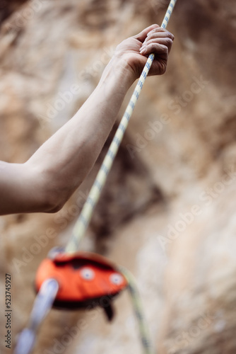 Hand holding a rock climbing rope