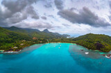 Aerial view of Mahe island with yachts, mountains and Indian Ocean in Seychelles