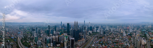 High angle view of sunrise at Kuala Lumpur city skyline with Petronas Twin Towers from Traders Hotel