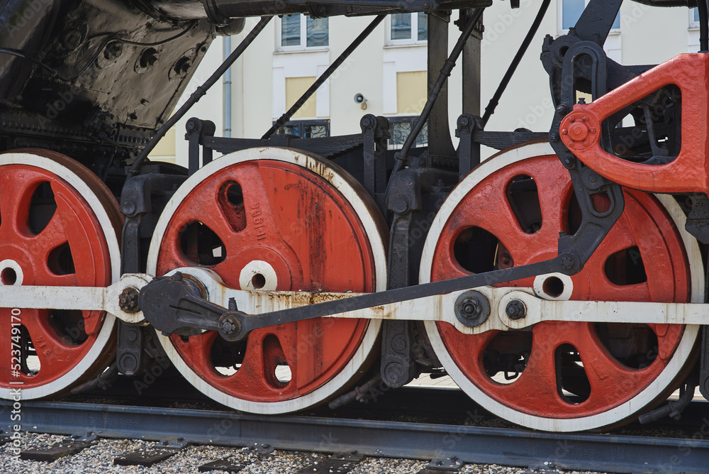 Steel wheels of a Soviet retro steam locomotive .