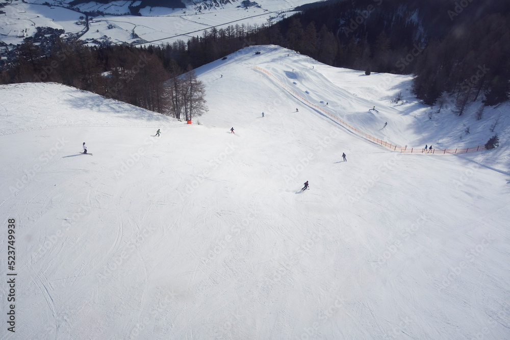 skiing on ski slope in winter vacation