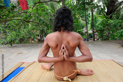 pashchima namaskarasana or reverse prayer pose in yoga photo