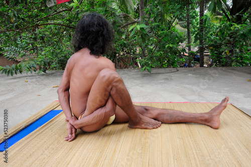 marichyasana or marichi pose in yoga photo