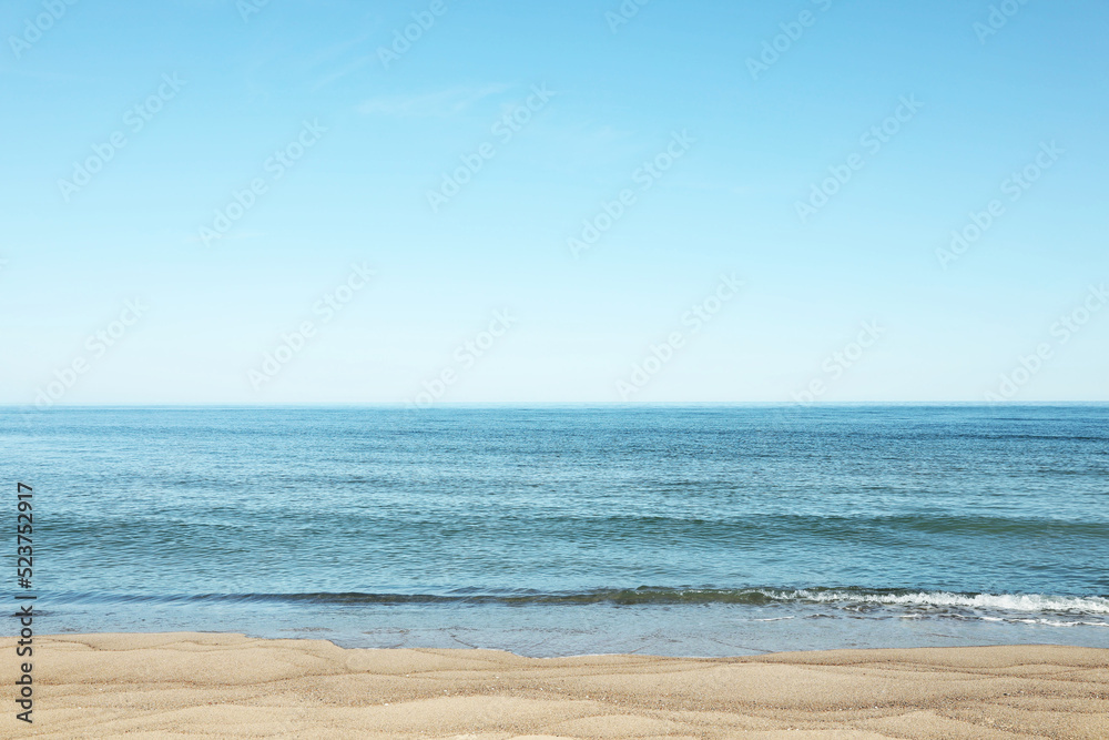 Picturesque view of sandy beach near sea
