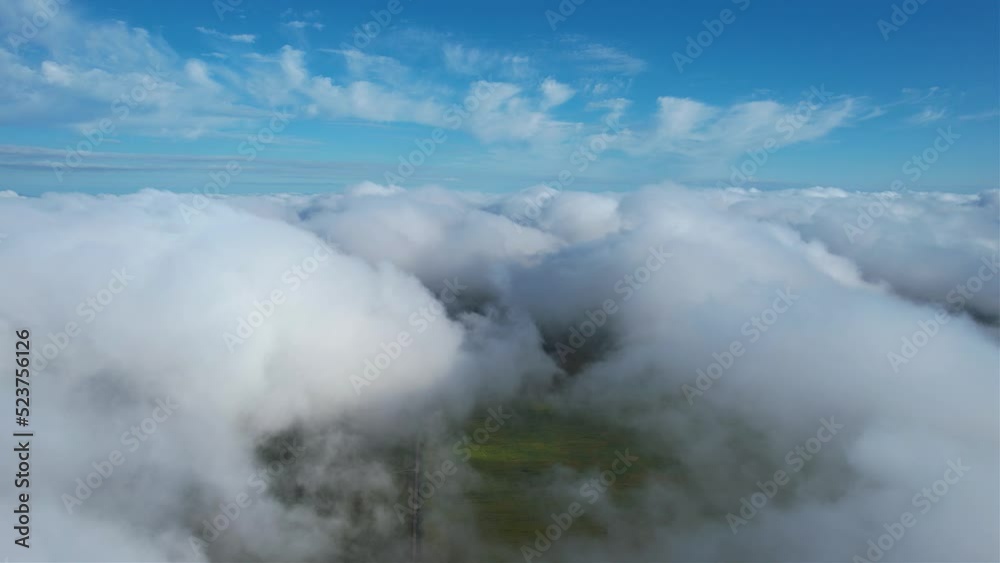 Flying over beautiful fluffy clouds