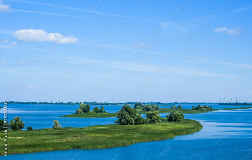 Obraz premium The Volga River, Russia. Tourist steamer floating on the Volga river channel, view from the quadcopter