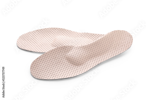 Beige comfortable orthopedic insoles isolated on white