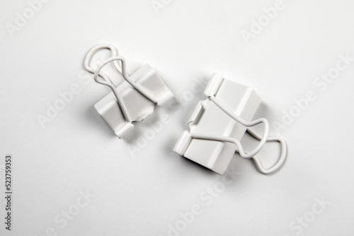 Binder clips on white background. Office Supplies