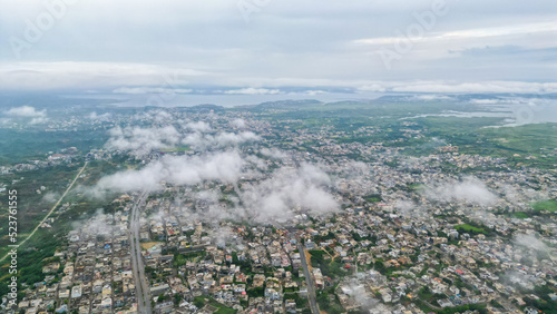 Aerial View of Mirpur Azad Kashmir city with fluffy clouds, Drone photography of Pakistan or India or South Asia © Muhammad