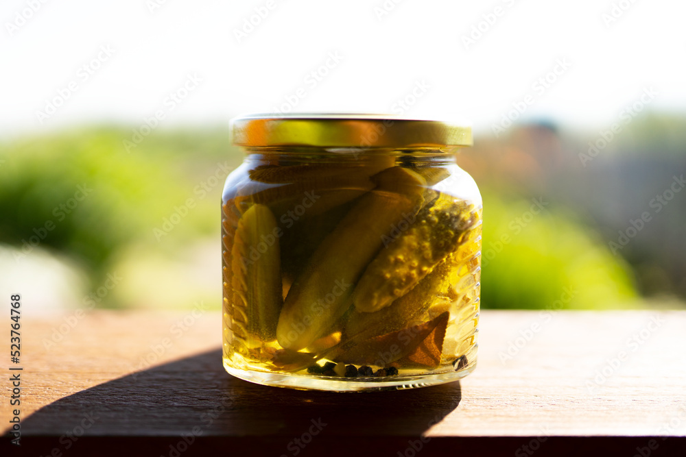 pickled cucumbers in a glass jar pickled cucumbers in a glass jar