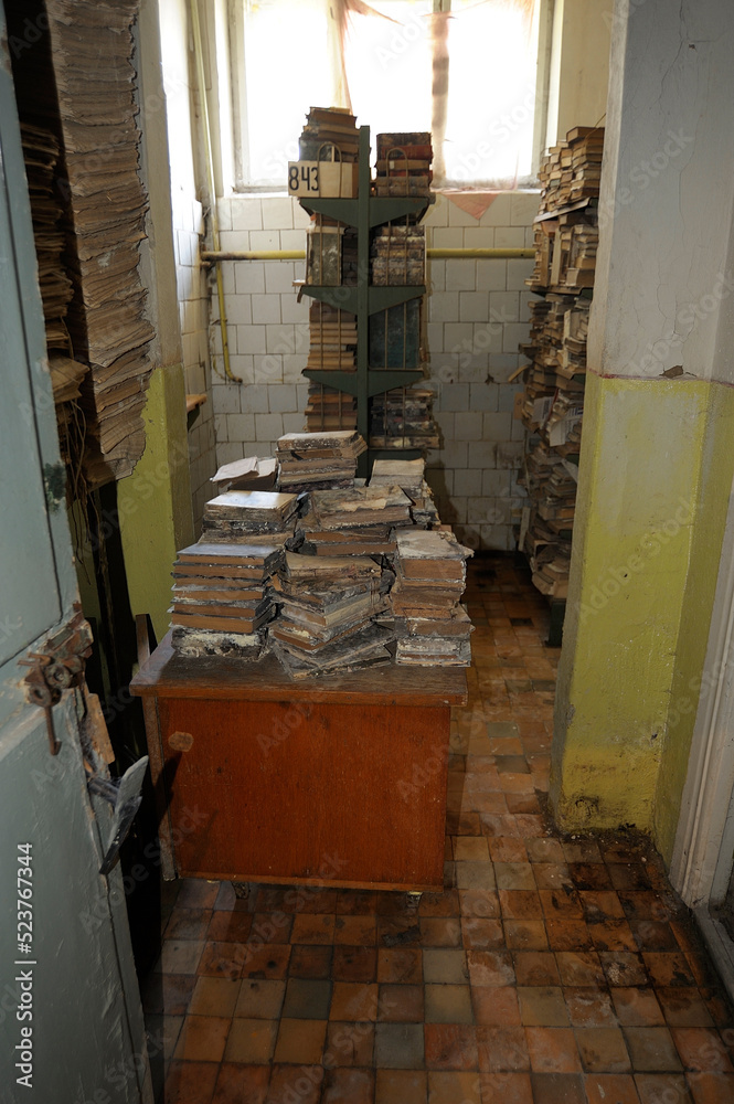 Pile of very old books in bad conditions, an archive room of Uzhgorod ...