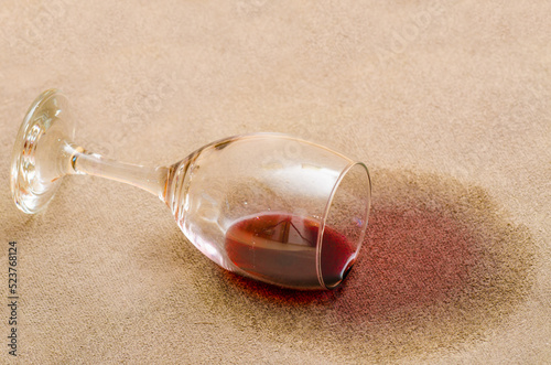 Red wine stain on a carpet inside a living room