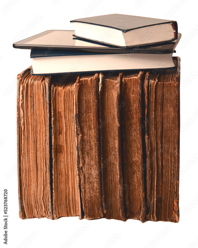 Row of old shabby brown books, new book and digital tablet on it isolated on white background. Old vs new concept. Closeup.