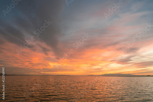 Sunset over the sea with cloudy and colorful beatiful sky view.