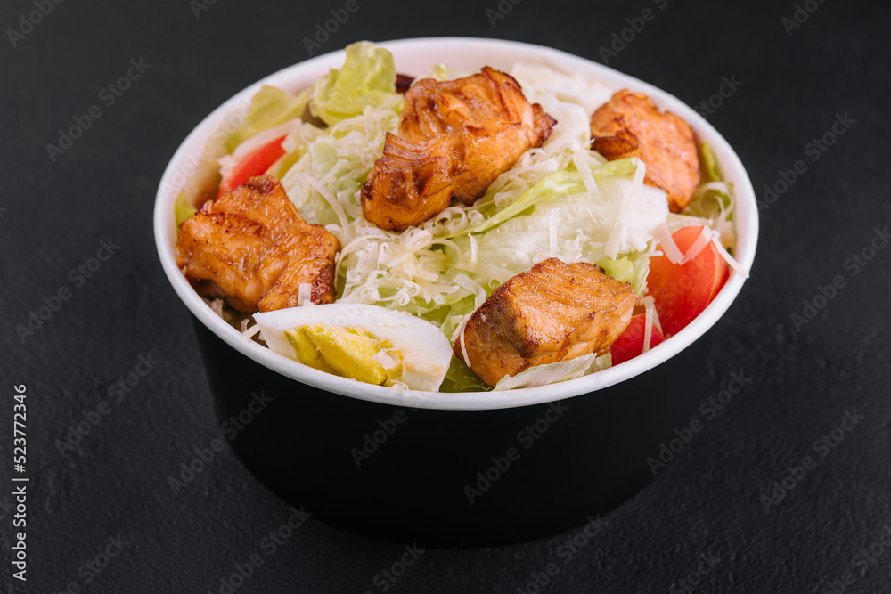 Caesar salad with chicken fillet and parmesan cheese Caesar salad with chicken fillet and parmesan cheese