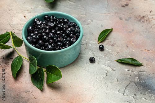 Wild berries, Northern berry: lingonberry, blueberry, Bowl of fresh maqui berry on light background, top view photo