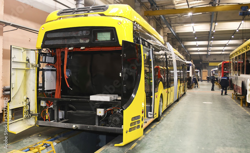 Trolleybuses parked at the trolleybus depot hangar for technical inspection.