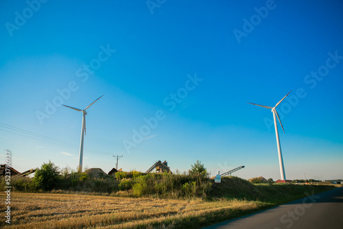 Windmills for electricity generation. Green energy concept. Background with copy space for text. Huge blades close up.