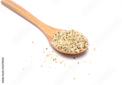 Hemp seeds on wooden spoon isolated on white background. high amgle view with copy space