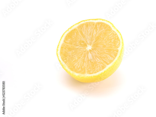 Fresh organic yellow lemon fruit with cut in half isolated on white background