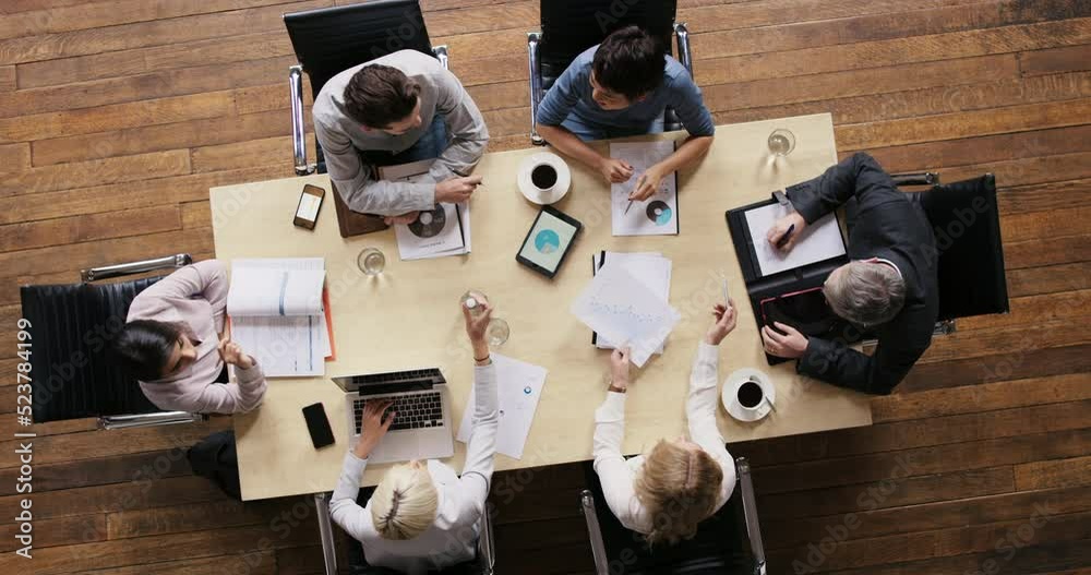 Busy business people planning, organizing and idea sharing in meeting, working together on finance chart or data for growth, innovation and development. Above of professional budget team on a mission