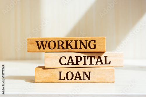 Wooden blocks with words 'WORKING CAPITAL LOAN'.