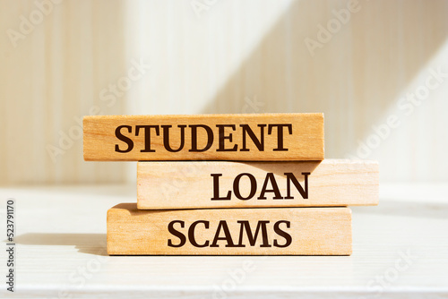 Wooden blocks with words 'Student Loan Scams'.