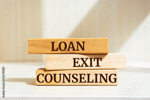 Fototapet Wooden blocks with words 'Loan Exit Counseling'.
