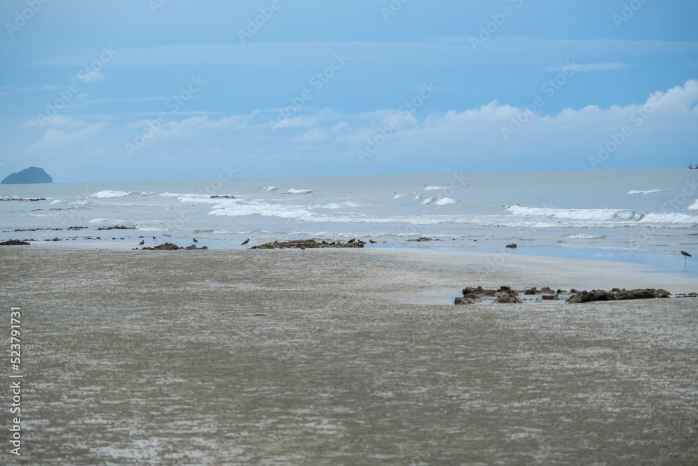 Stones beach background and texture. Rocks on the beach. Sea sand sky and summer day. Summer beach background. Stones beach background and texture. Rocks on the beach. Sea sand sky and summer day. Summer beach background.